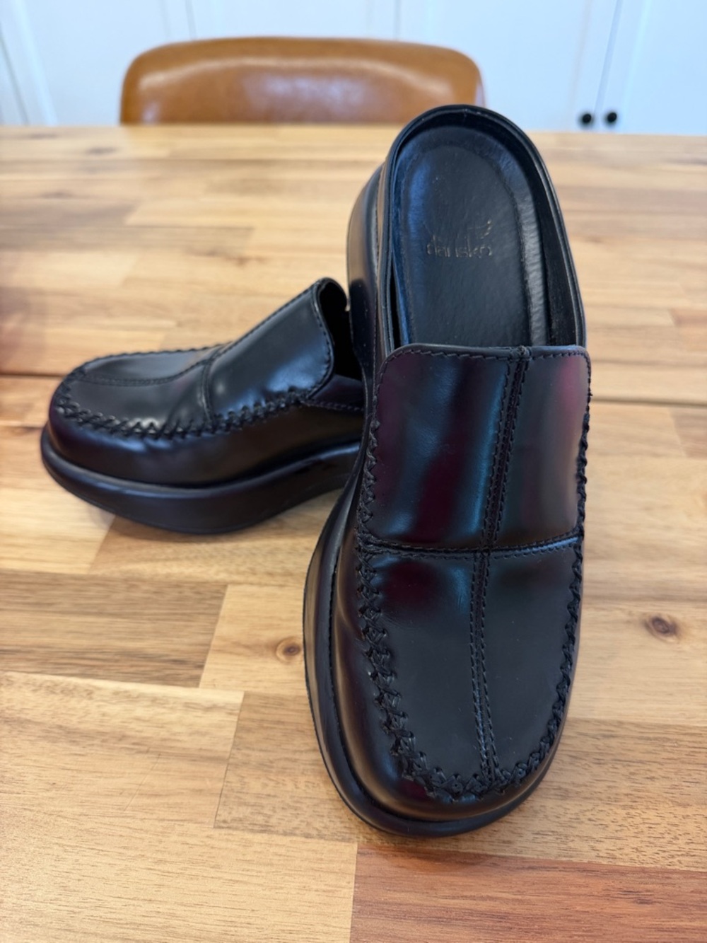 Dansko Black Leather Slip-On Clogs with Moc Toe Stitching
